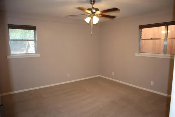 a kitchen with granite countertop a sink stove and refrigerator