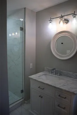 a bathroom with a sink and a mirror