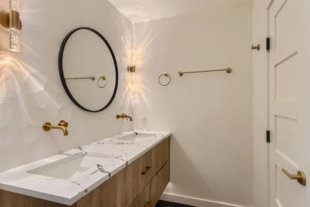 a bathroom with a sink and a mirror
