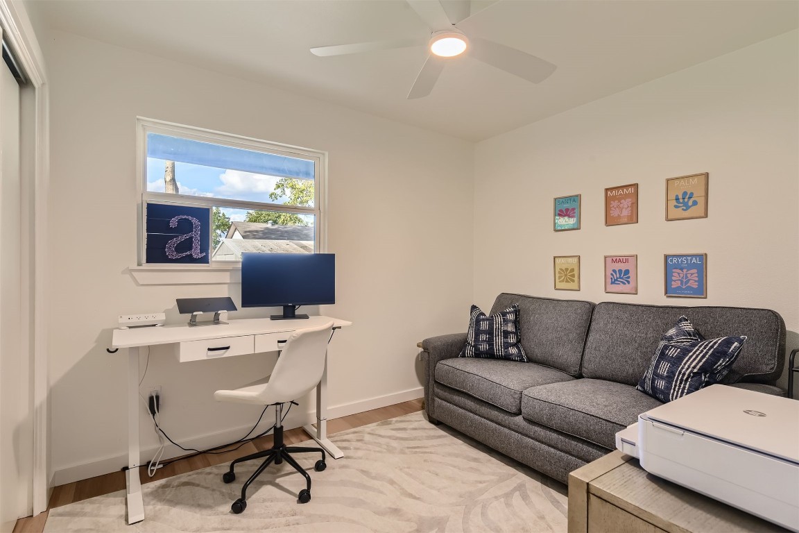 1112 Milford Way Austin, TX 78745 - Photo 16 of 25 a view of a livingroom with workspace and a couch