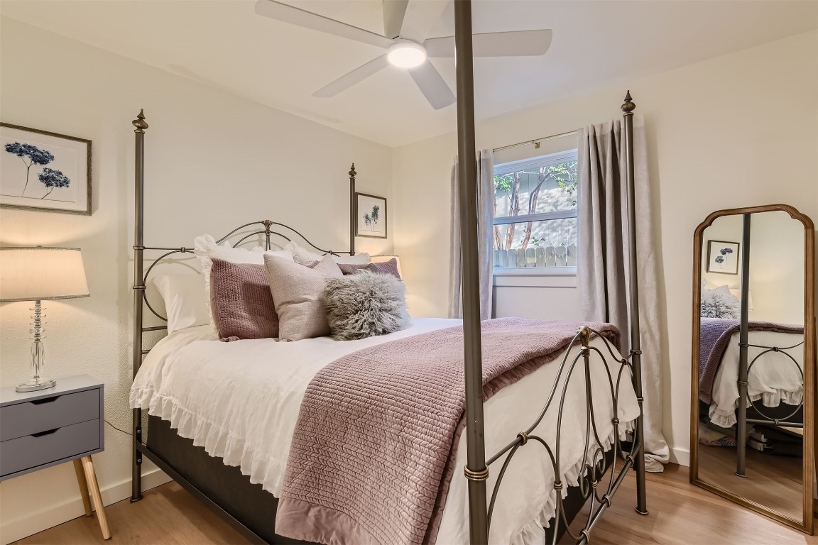 1112 Milford Way Austin, TX 78745 - Photo 18 of 25 a bedroom with a large bed and flat screen tv