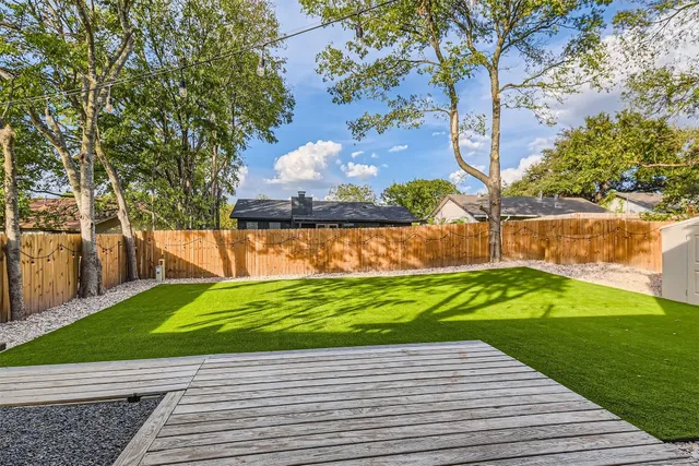 a view of a pathway with a yard