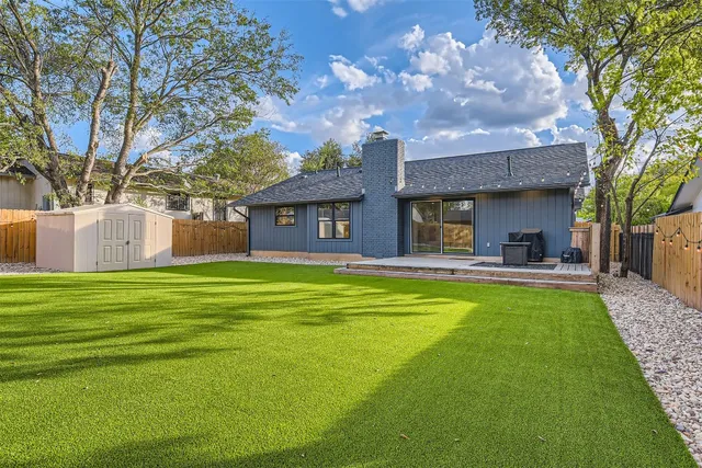 a house view with swimming pool and garden space