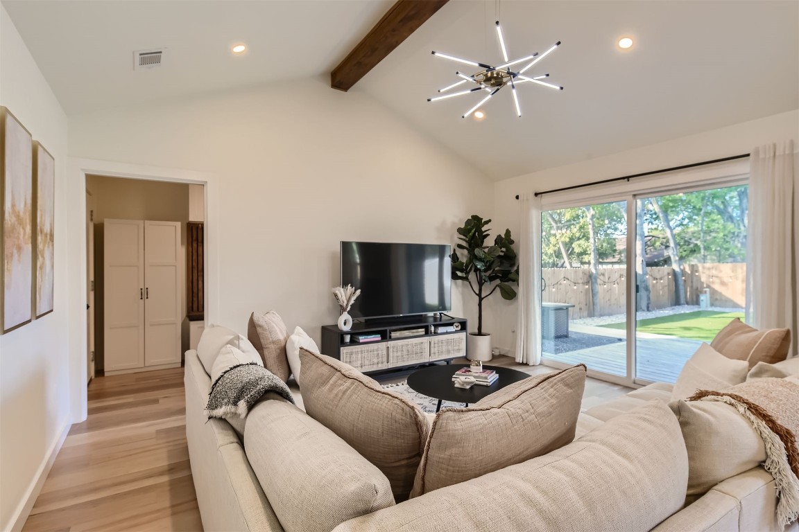 1112 Milford Way Austin, TX 78745 - Photo 5 of 25 a living room with furniture and a flat screen tv