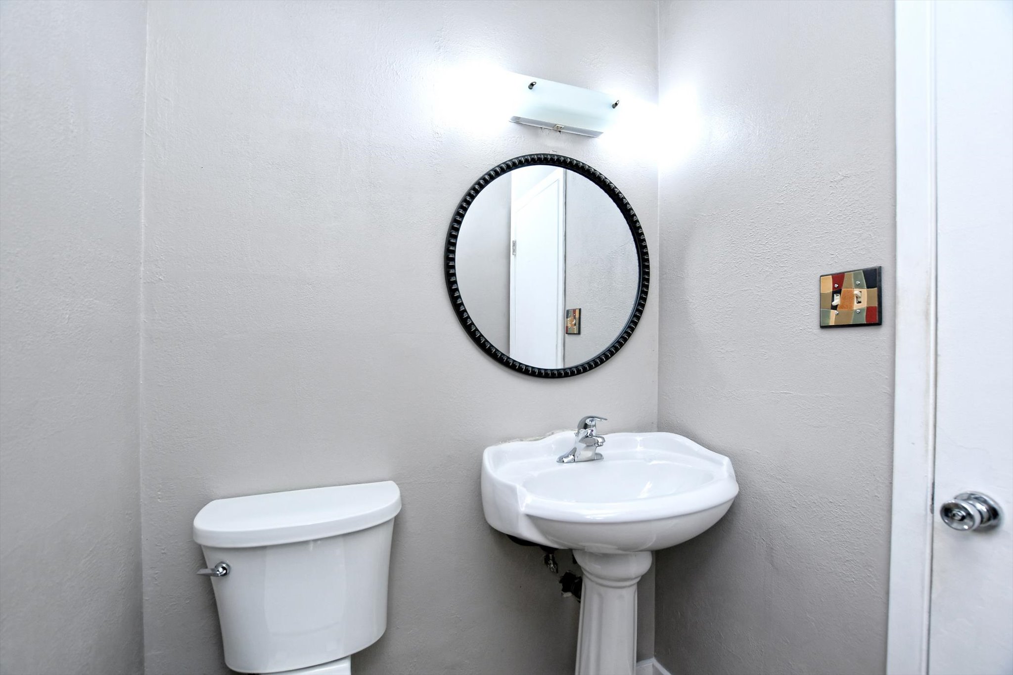 7509 Daugherty Street Austin, TX 78757 - Photo 12 of 24 a bathroom with a sink and a mirror