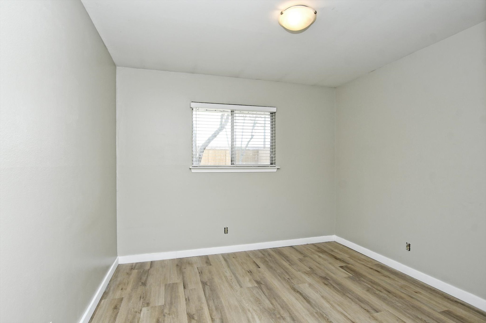 7509 Daugherty Street Austin, TX 78757 - Photo 13 of 24 an empty room with a window