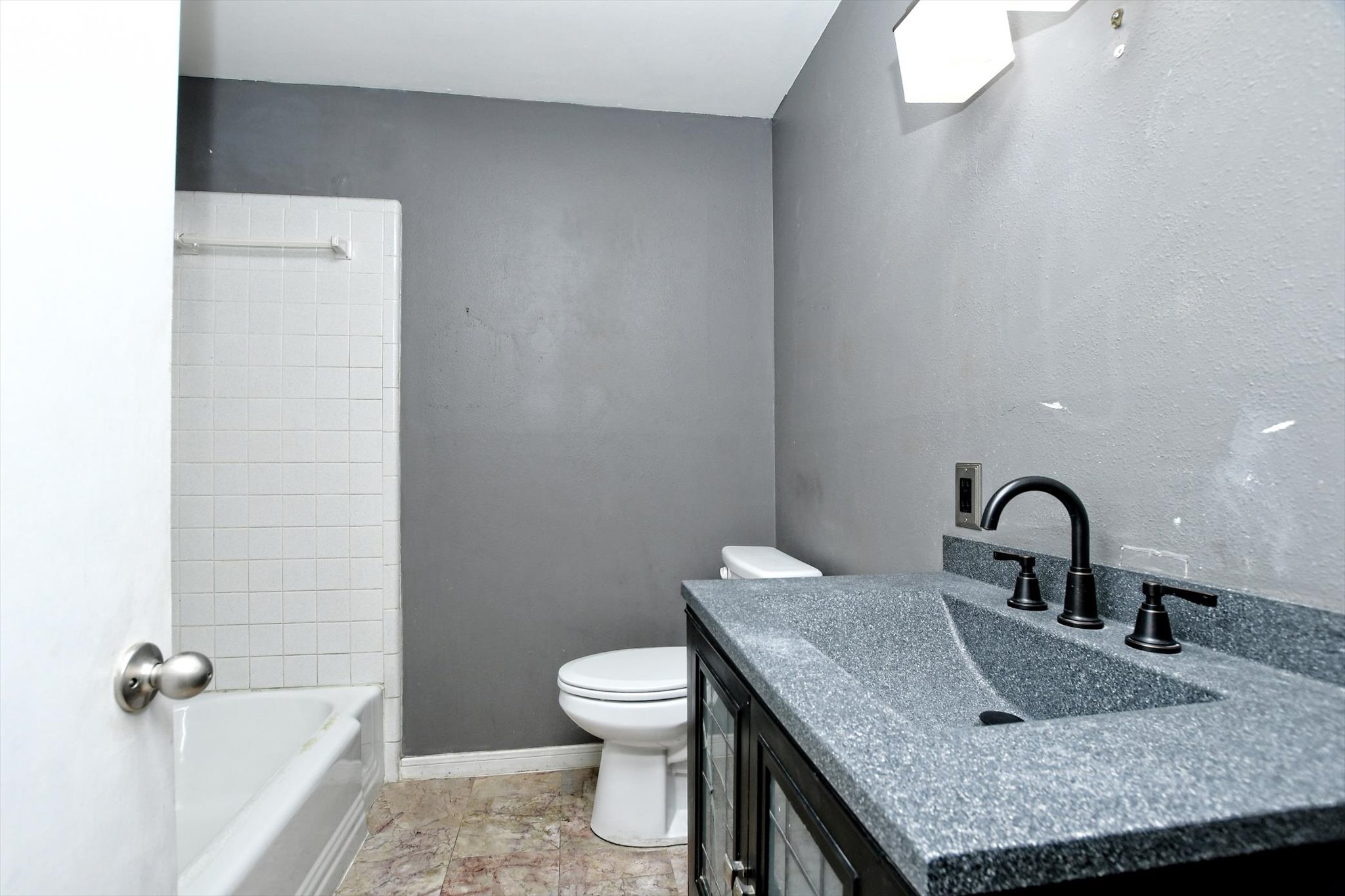 7509 Daugherty Street Austin, TX 78757 - Photo 14 of 24 a bathroom with a granite countertop sink toilet and mirror