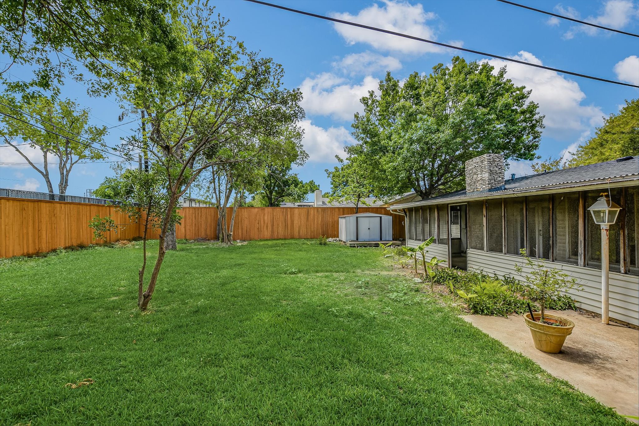 7509 Daugherty Street Austin, TX 78757 - Photo 23 of 24 a backyard of a house with lots of green space