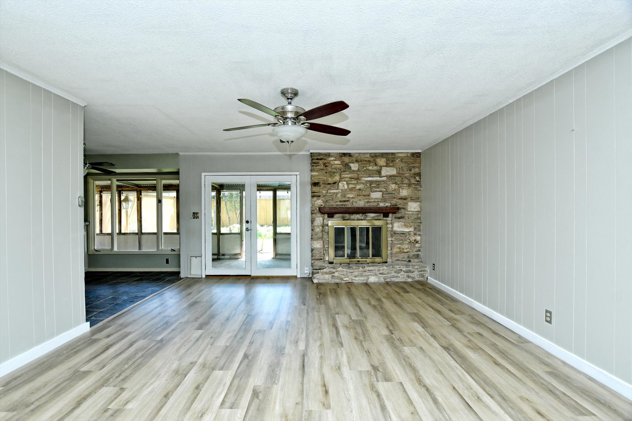 7509 Daugherty Street Austin, TX 78757 - Photo 6 of 24 wooden floor in an empty room with a window