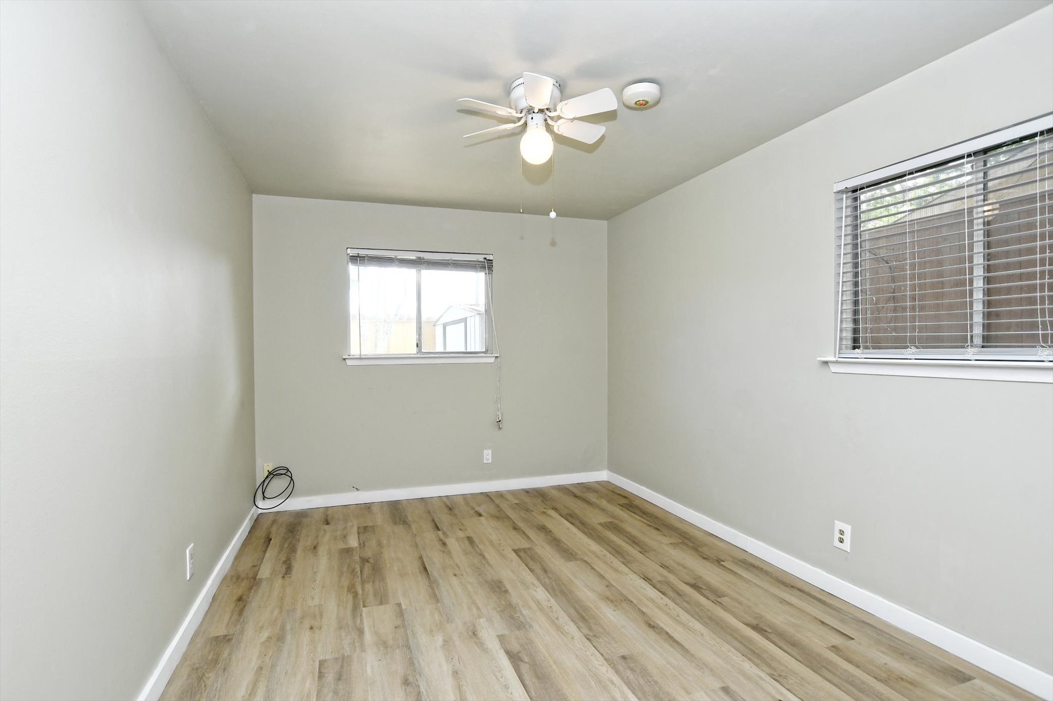 7509 Daugherty Street Austin, TX 78757 - Photo 10 of 24 an empty room with a window and a fan