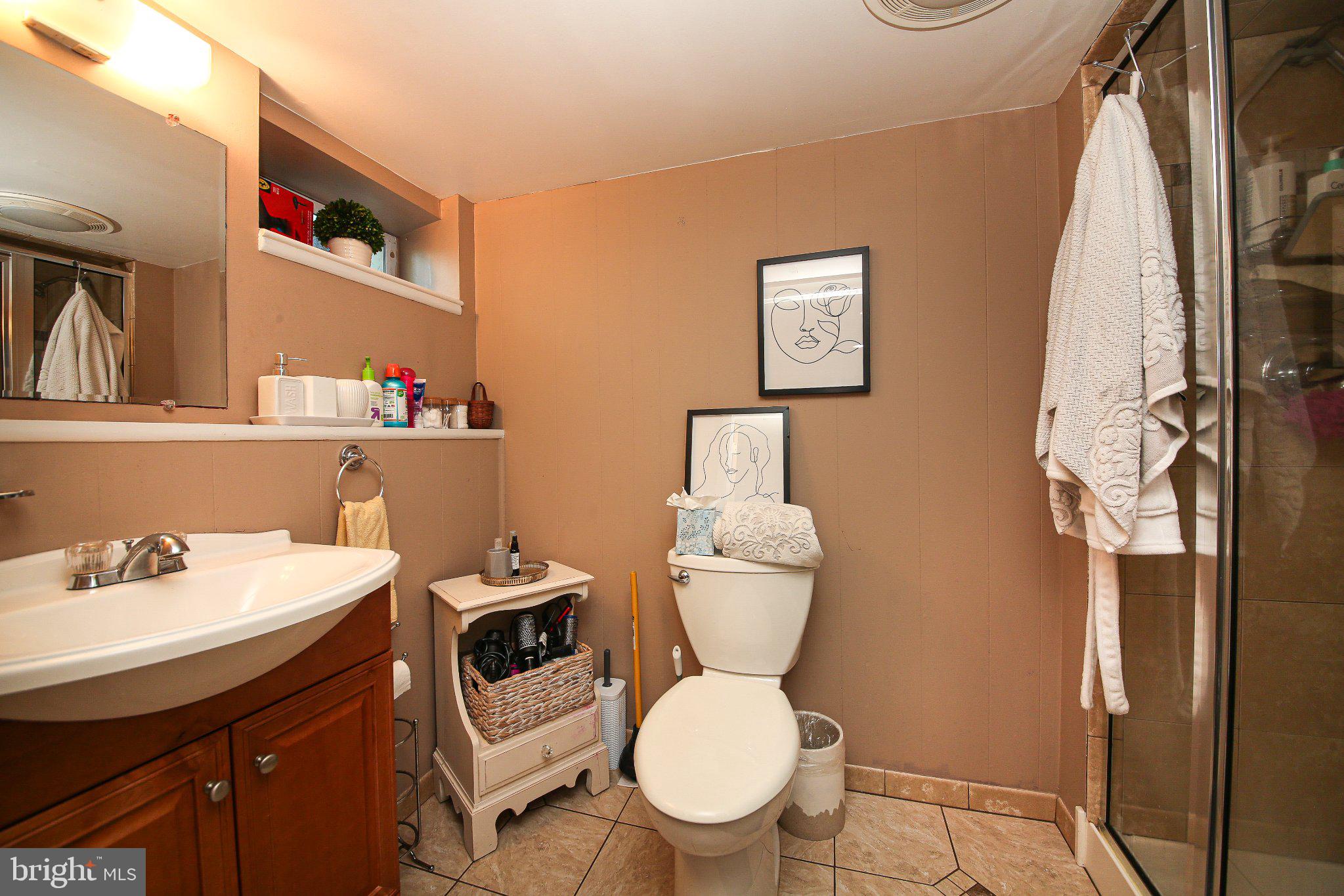 158 South Shady Retreat Road Doylestown, PA 18901 - Photo 13 of 22 a white toilet sitting next to a bathroom sink