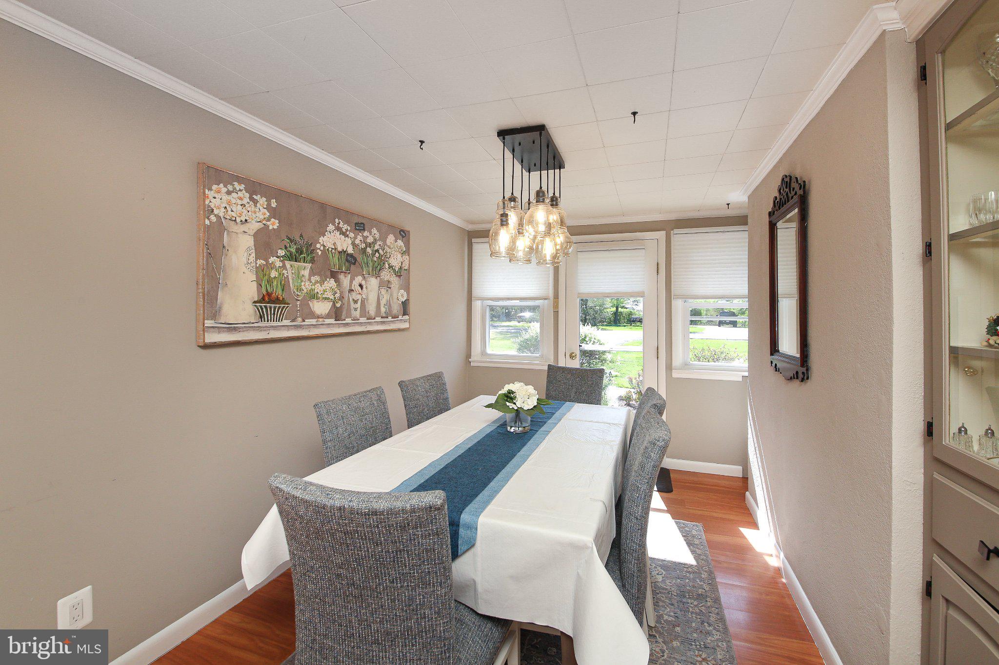 158 South Shady Retreat Road Doylestown, PA 18901 - Photo 19 of 22 a view of a dining room with furniture a chandelier and wooden floor