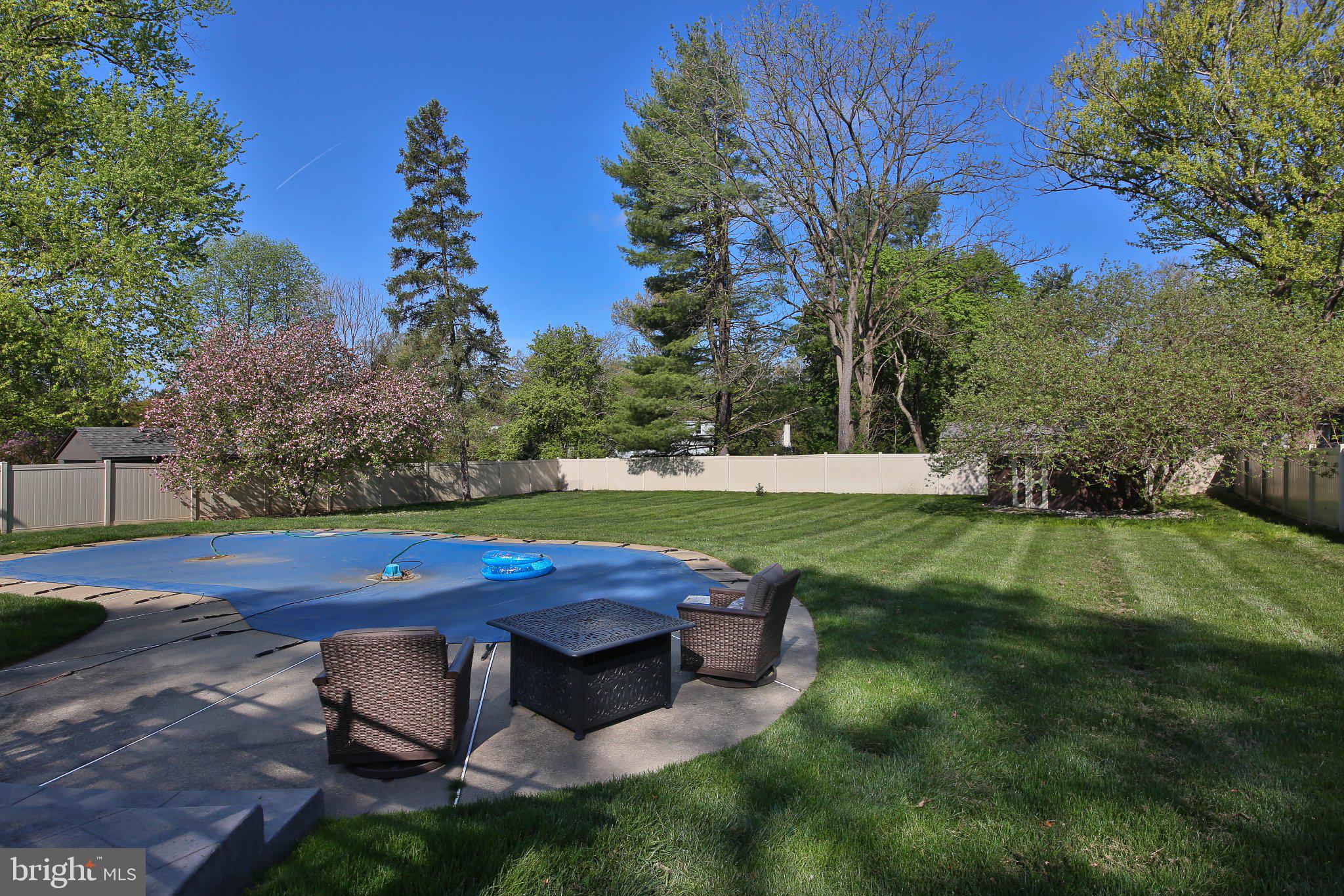 158 South Shady Retreat Road Doylestown, PA 18901 - Photo 3 of 22 a view of a backyard with table and chairs plants and trees