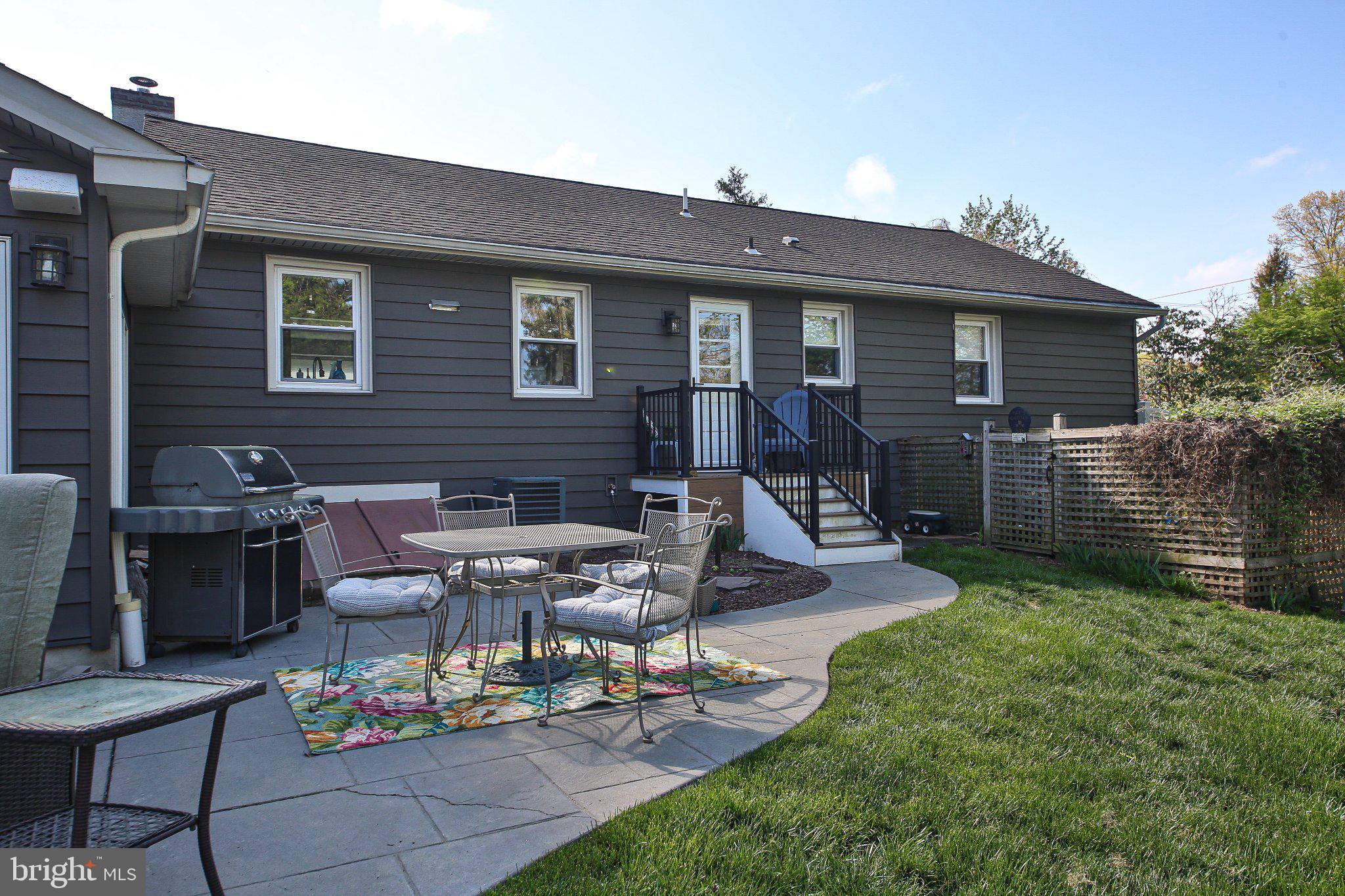 158 South Shady Retreat Road Doylestown, PA 18901 - Photo 8 of 22 a view of a patio with table and chairs with wooden fence