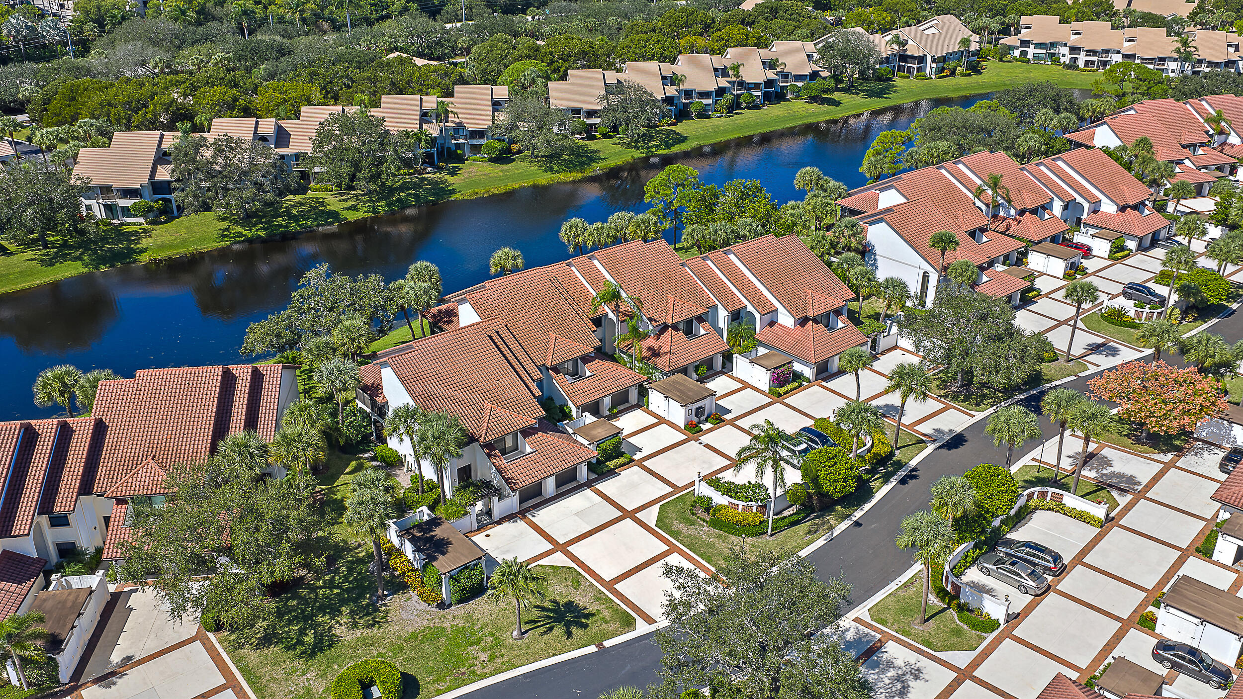 16647 Traders Crossing North, Unit 126 Jupiter, FL 33477 - Photo 37 of 45 an aerial view of a house with a lake view