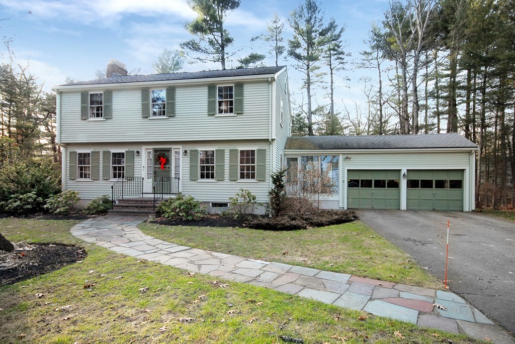 48 Wilson Road Concord, MA 01742 - Photo 1 of 41 a front view of a house with a yard and potted plants