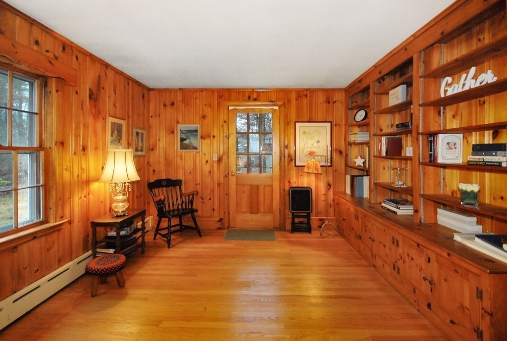 48 Wilson Road Concord, MA 01742 - Photo 17 of 41 a view of a large room with furniture and windows
