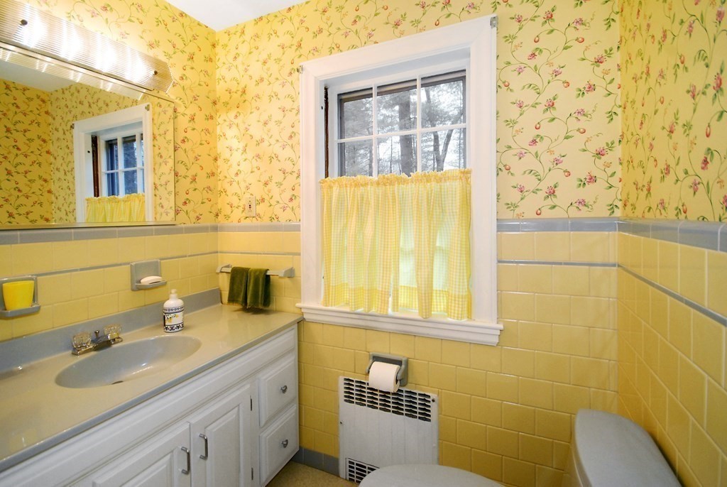 48 Wilson Road Concord, MA 01742 - Photo 20 of 41 a bathroom with a granite countertop sink and a mirror