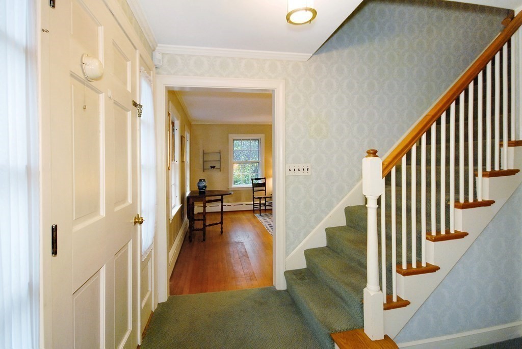 48 Wilson Road Concord, MA 01742 - Photo 31 of 41 a view of entryway and hall with wooden floor