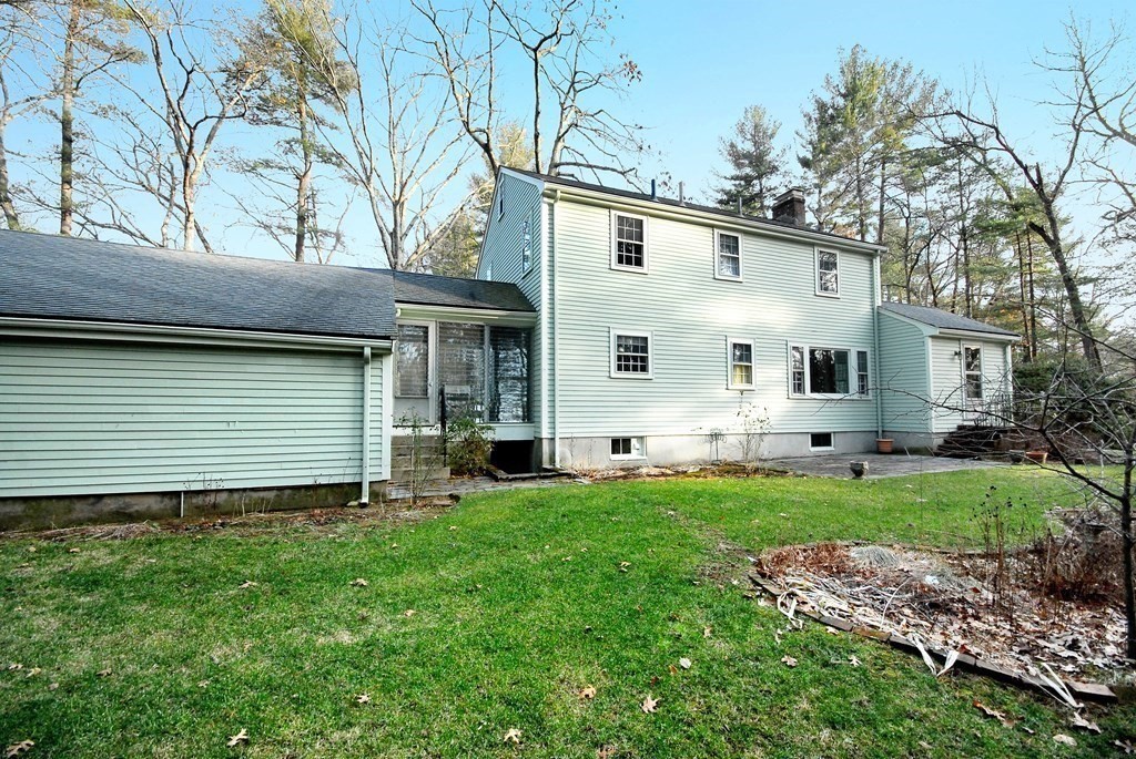 48 Wilson Road Concord, MA 01742 - Photo 35 of 41 a backyard of a house with table and chairs