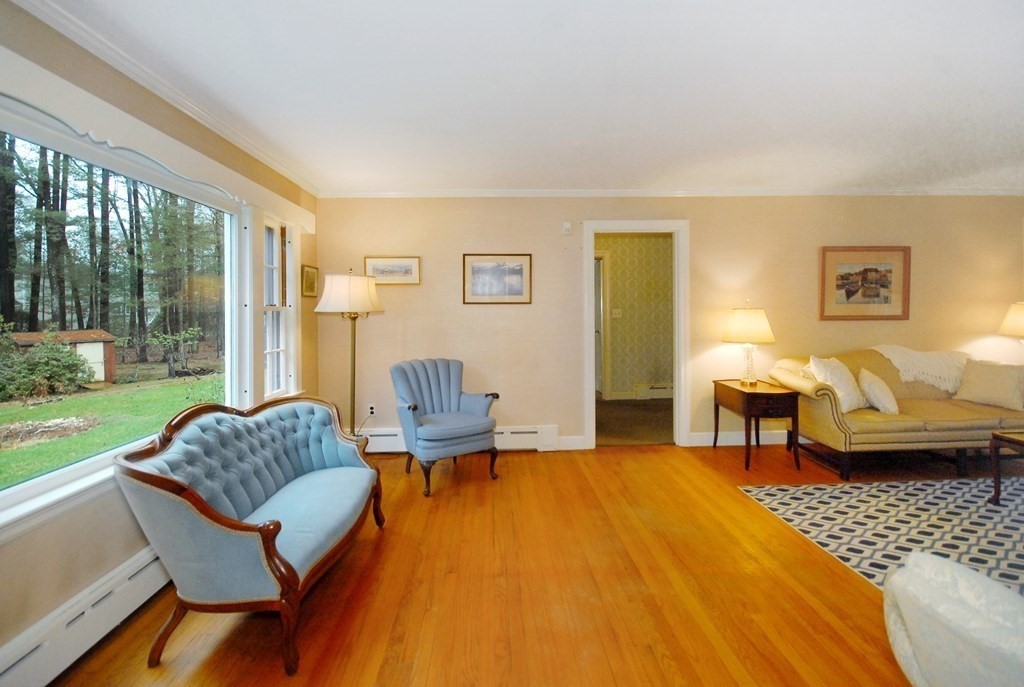 48 Wilson Road Concord, MA 01742 - Photo 10 of 41 a living room with furniture and a rug