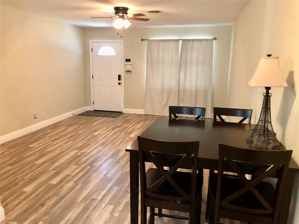 2127 East Mitchell Street Arlington, TX 76010 - Photo 3 of 20 a view of a dining room with furniture and wooden floor