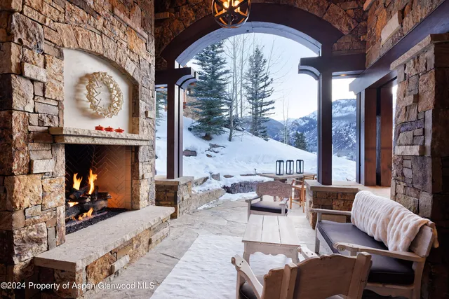 a living room with furniture fireplace and flat screen tv