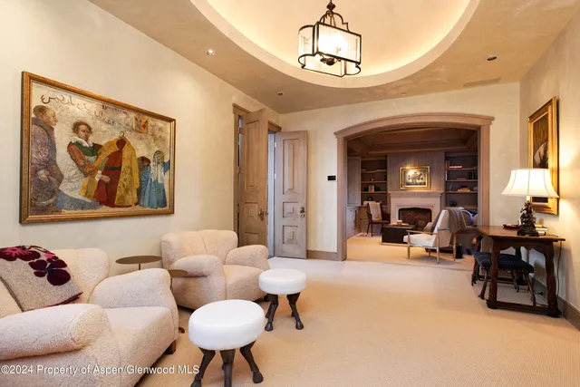 a bedroom with a bed and a fireplace