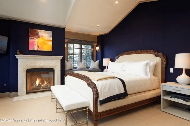 a view of walk in closet with clothes