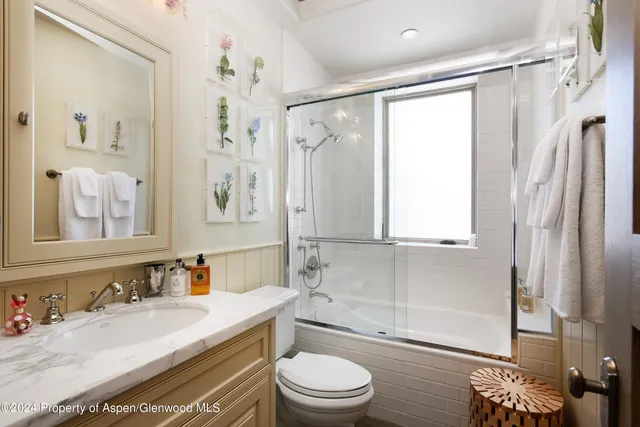 a view of a patio with dining table and chairs