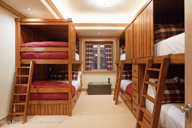 a view of a building with garden and sitting area