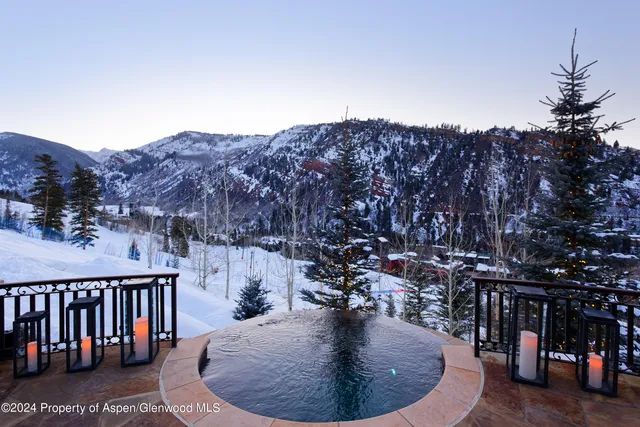 a view of a patio with chairs and a table