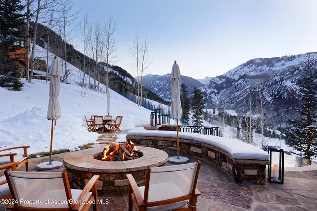 an outdoor space with furniture and garden view
