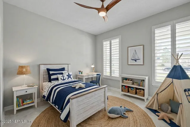 a bedroom with bed and window