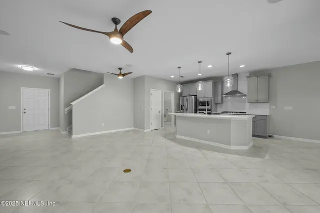 a kitchen with stainless steel appliances granite countertop a sink and stove
