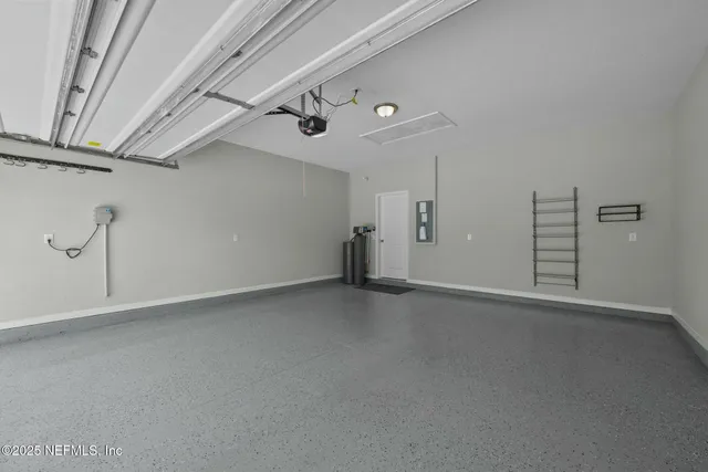 an aerial view of a house with a ocean view