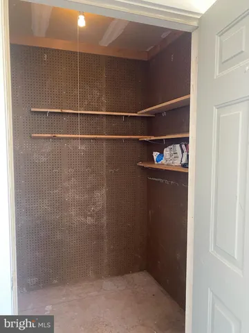 a view of a chairs and table in the balcony