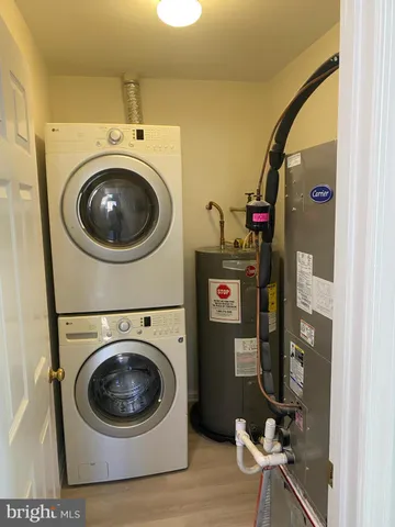 a white toilet and tub next to a shower
