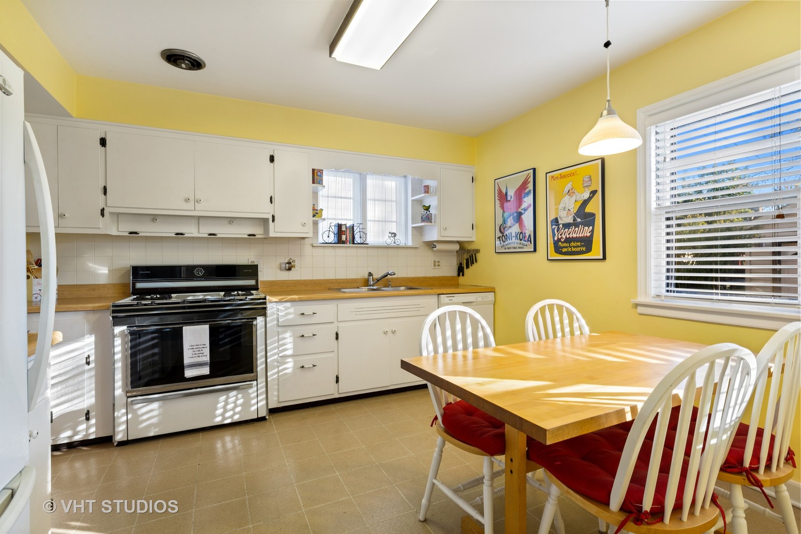 11 Elmore Street Park Ridge, IL 60068 - Photo 7 of 20 a kitchen with stainless steel appliances a stove a sink dishwasher and cabinets