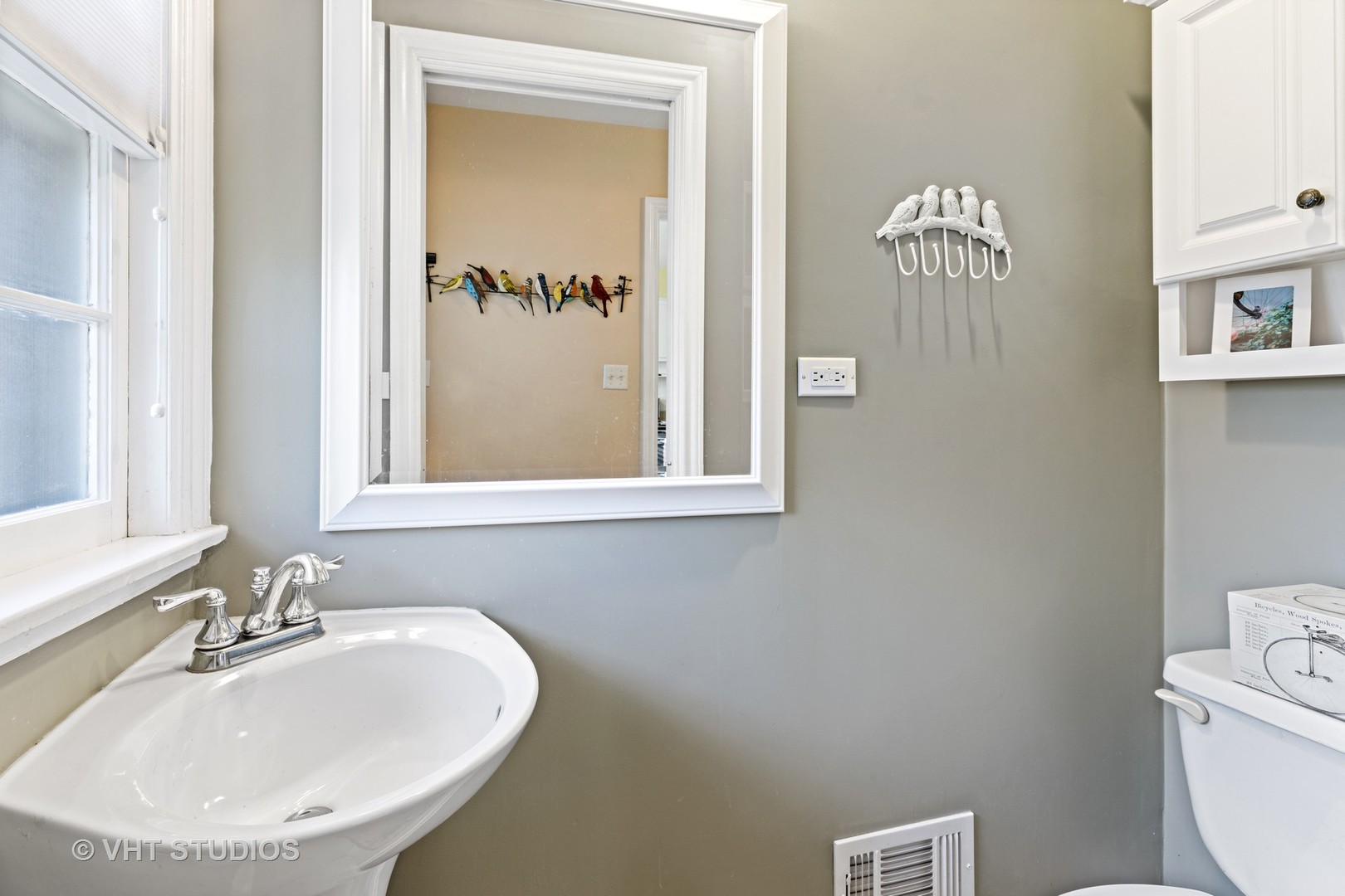 11 Elmore Street Park Ridge, IL 60068 - Photo 8 of 20 a bathroom with a sink and a mirror