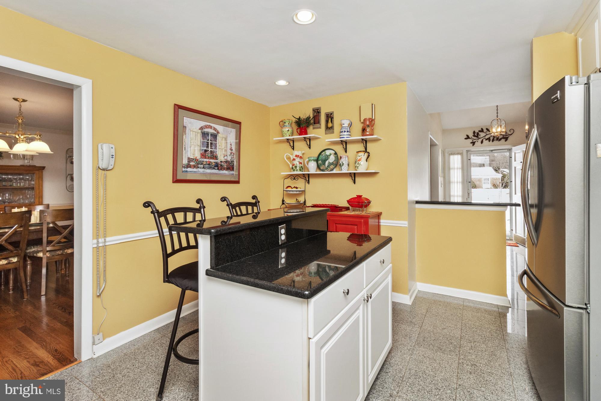 1002 Dunblane Road Towson, MD 21286 - Photo 14 of 59 a kitchen with stainless steel appliances granite countertop a sink stove and refrigerator