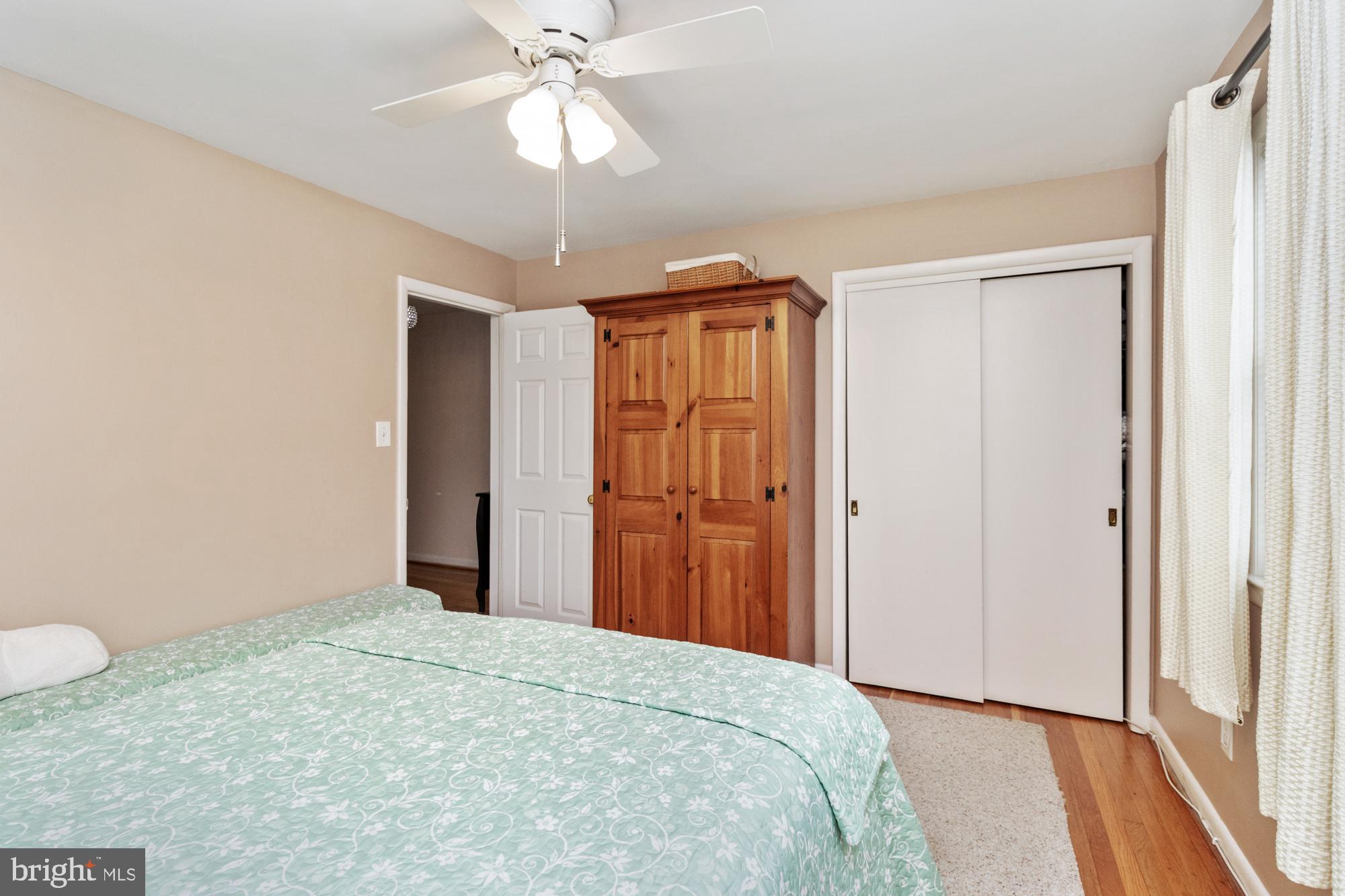 1002 Dunblane Road Towson, MD 21286 - Photo 26 of 59 a bedroom with a bed and a chandelier