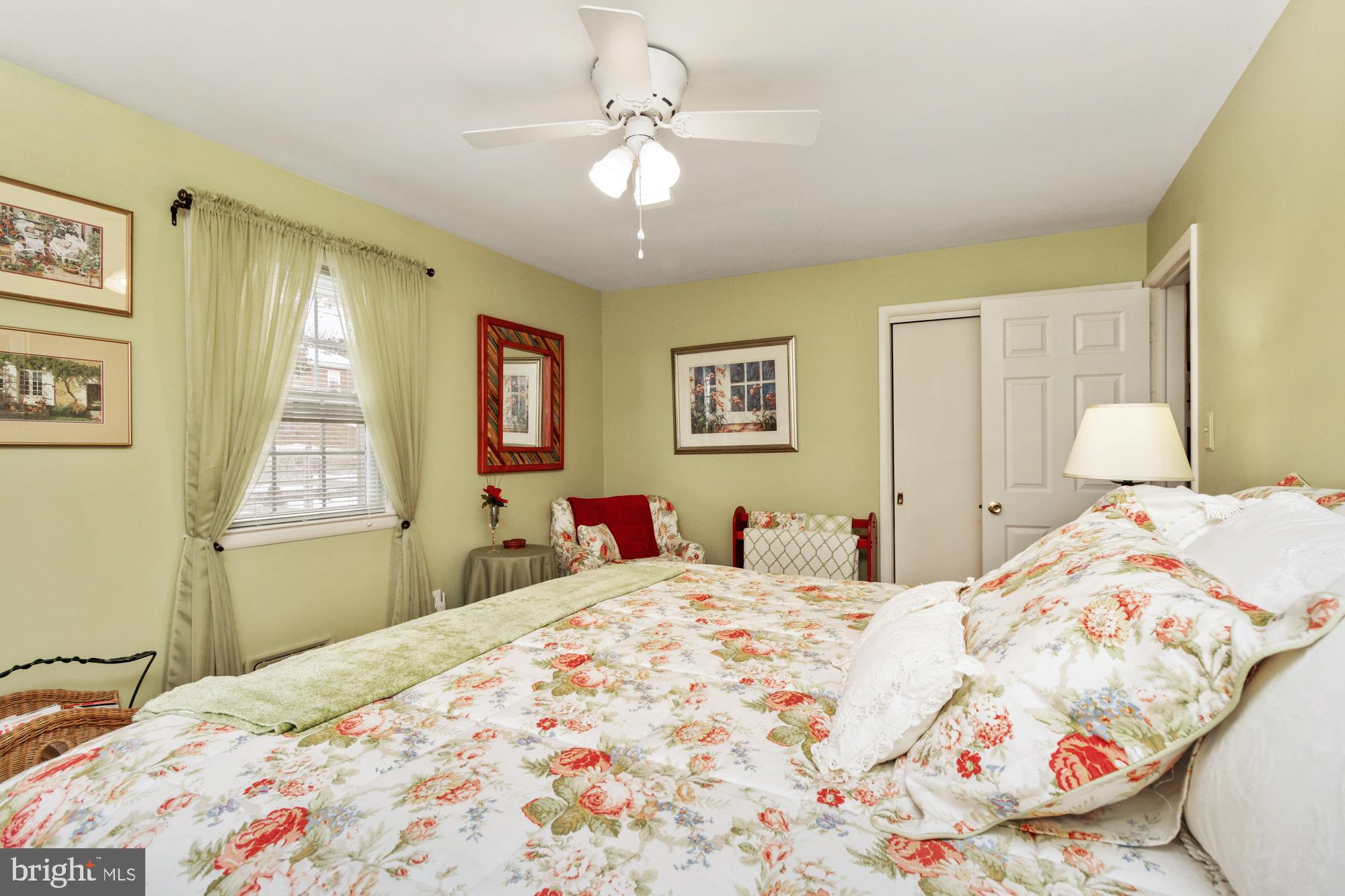 1002 Dunblane Road Towson, MD 21286 - Photo 29 of 59 a bedroom with a bed and a chandelier