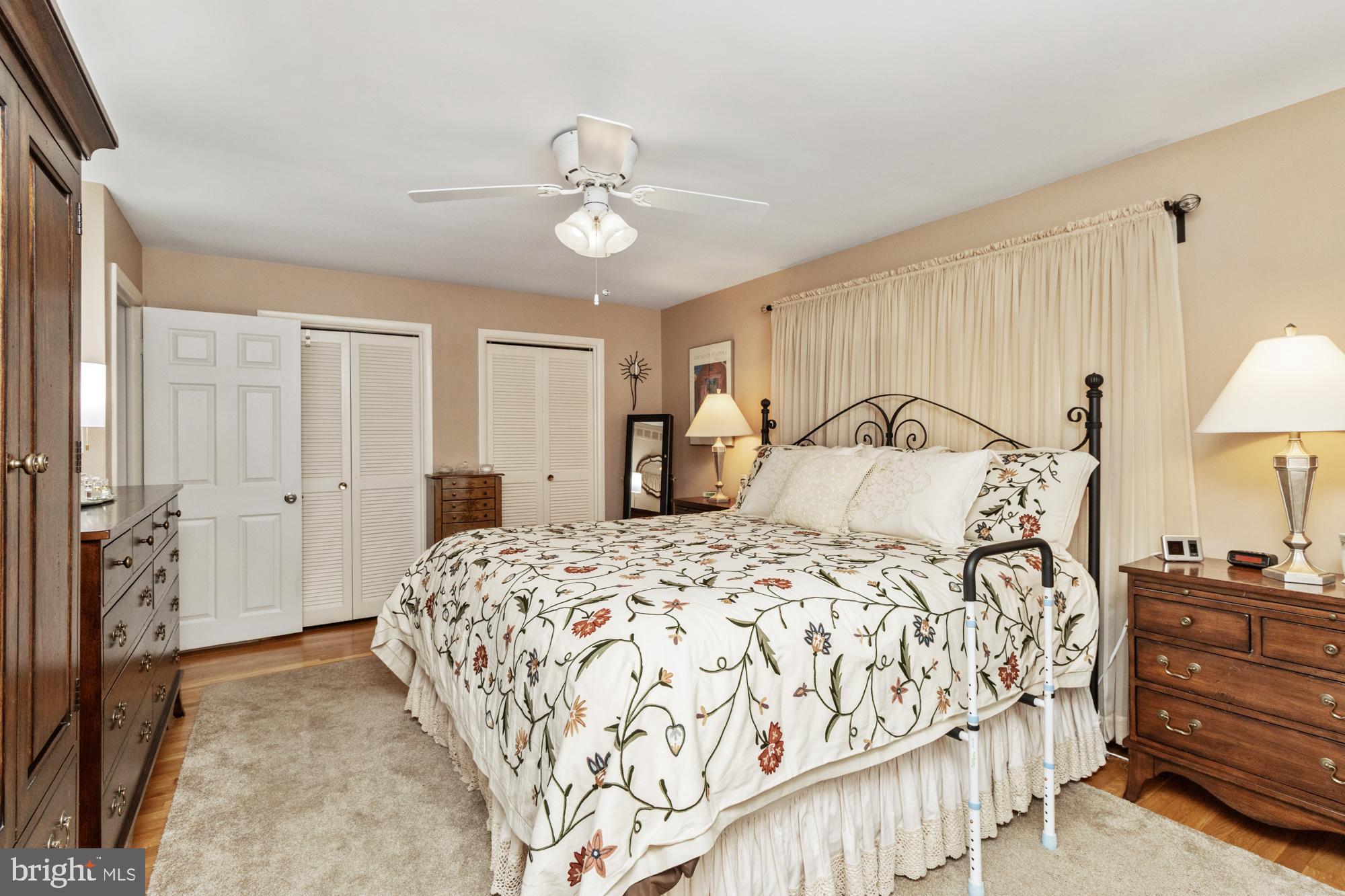 1002 Dunblane Road Towson, MD 21286 - Photo 34 of 59 a bedroom with a large bed and a chandelier