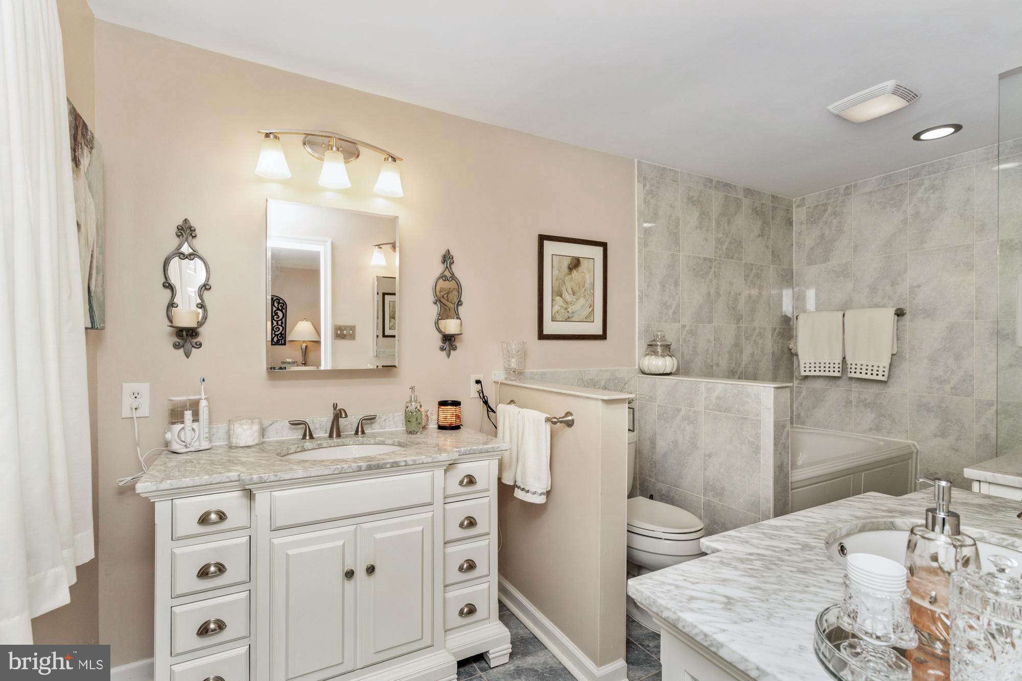 1002 Dunblane Road Towson, MD 21286 - Photo 35 of 59 a bathroom with a granite countertop sink mirror and a
