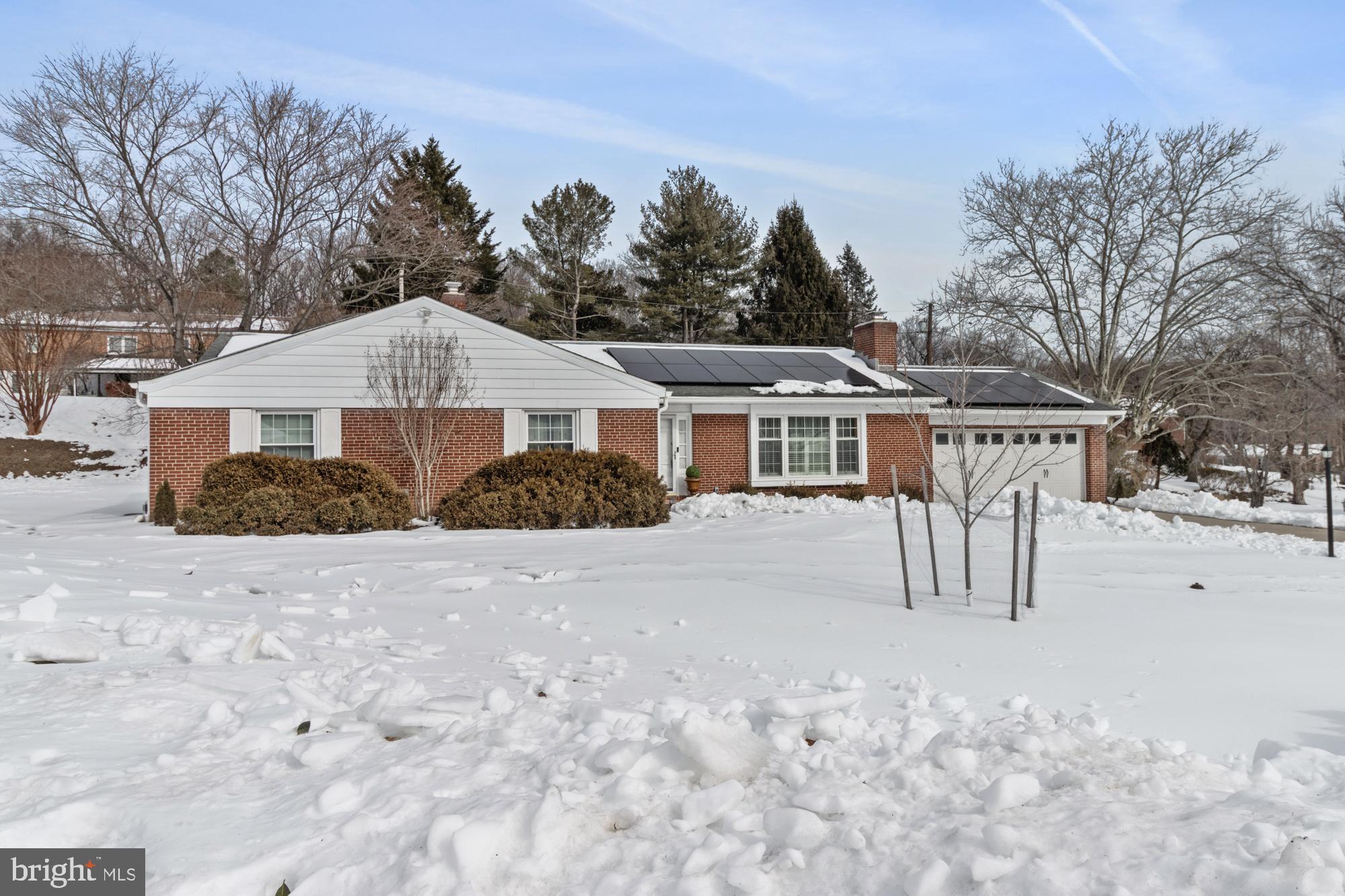 1002 Dunblane Road Towson, MD 21286 - Photo 4 of 59 a view of a house with a yard covered in snow