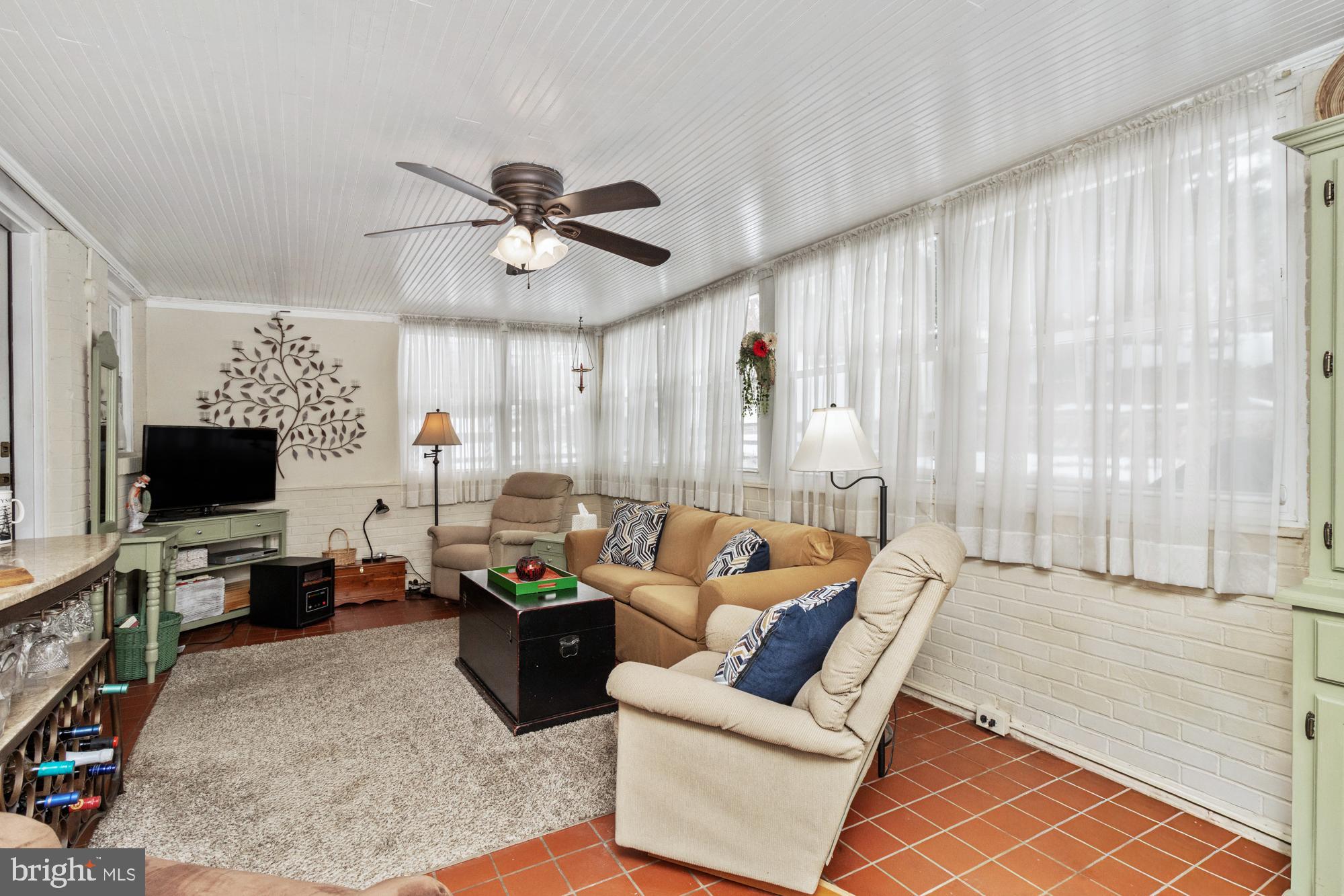 1002 Dunblane Road Towson, MD 21286 - Photo 42 of 59 a living room with furniture and a flat screen tv