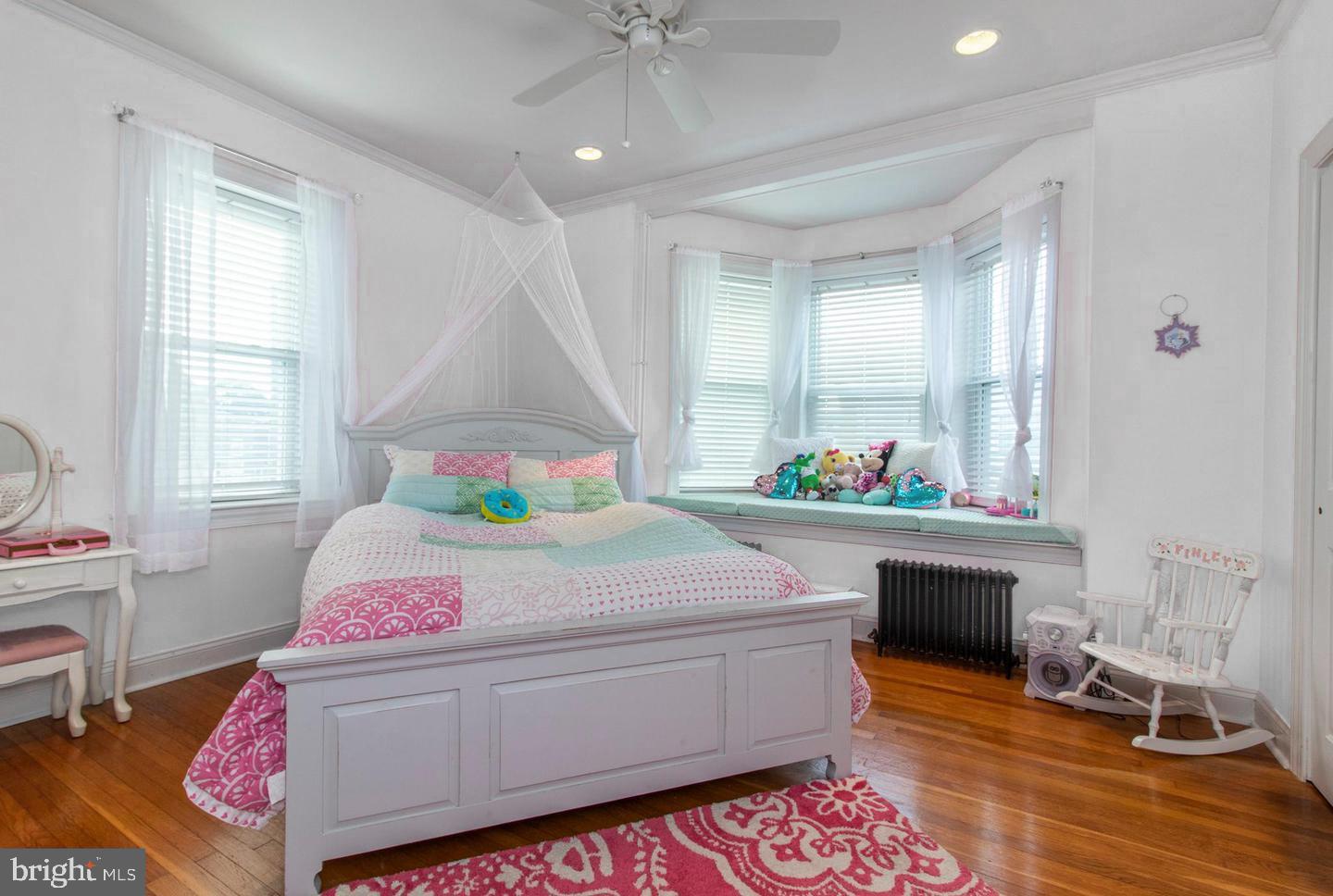 317-19 Rector Street Philadelphia, PA 19128 - Photo 13 of 29 a bed room with a bed and a table