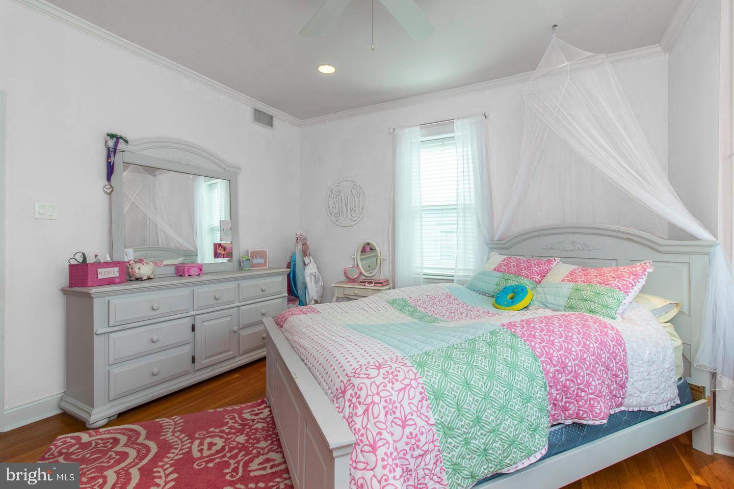 317-19 Rector Street Philadelphia, PA 19128 - Photo 14 of 29 a bedroom with a bed and a dresser in it