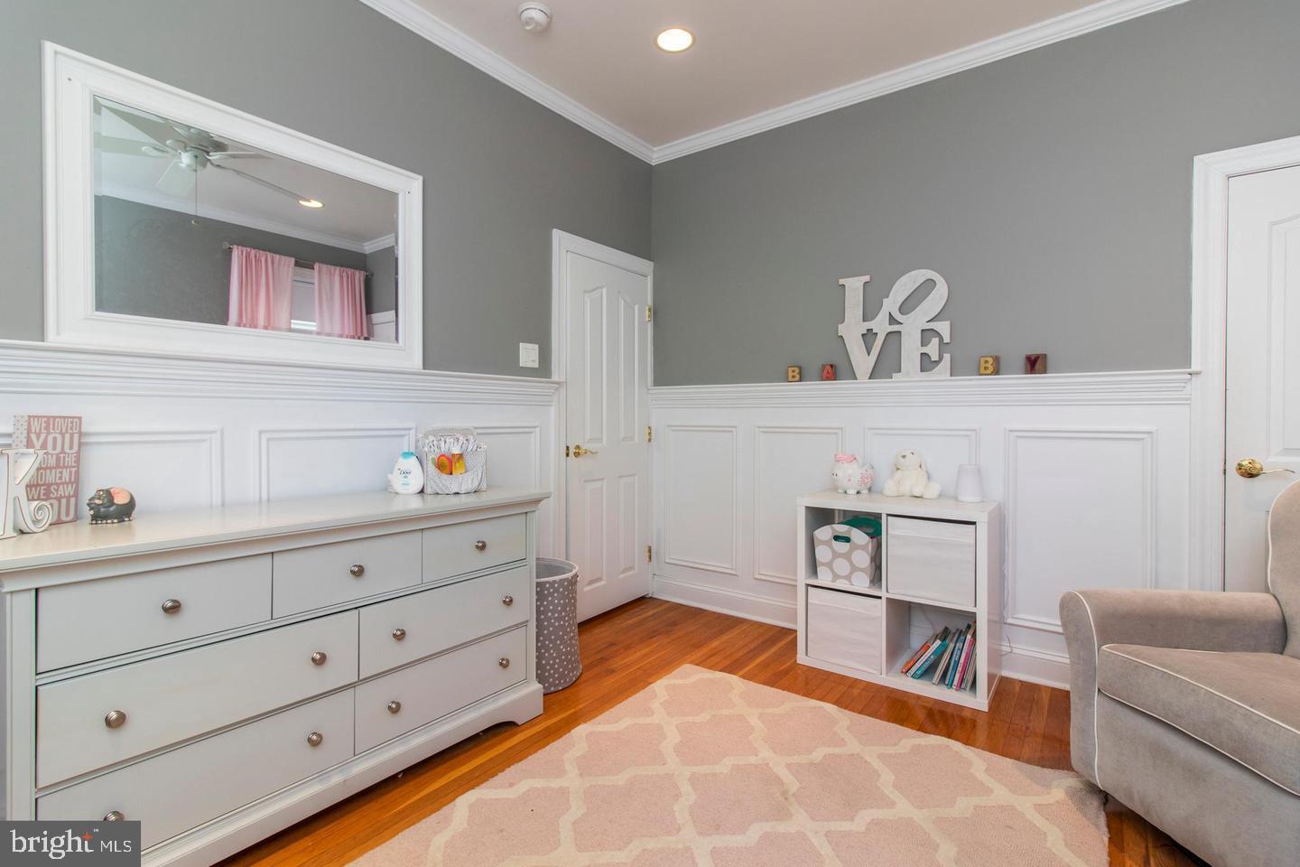 317-19 Rector Street Philadelphia, PA 19128 - Photo 15 of 29 a bedroom with a bed and a couch